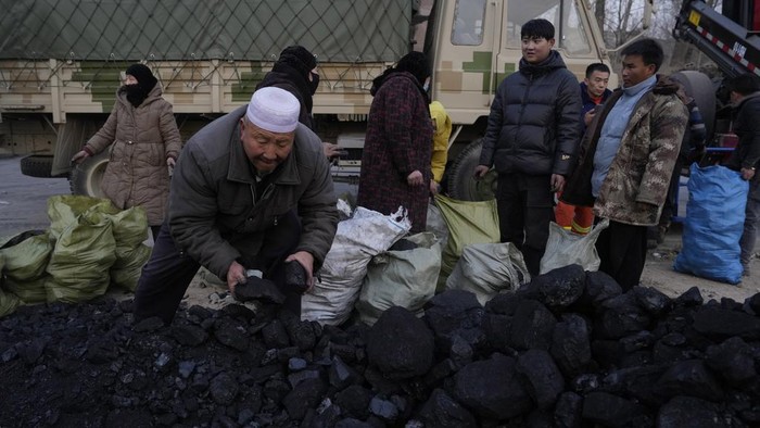 Residents seek shelter in government tents in Dahejia town in northwestern China's Gansu province, Wednesday, Dec. 20, 2023. A strong overnight earthquake rattled a mountainous region of northwestern China, authorities said Tuesday, destroying homes, leaving residents out in a below-freezing winter night and killing many in the nation's deadliest quake in nine years. (AP Photo/Ng Han Guan)