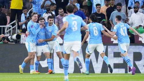 Manchester Citys Julian Alvarez, 2nd left, celebrates after scoring the opening goal during the Soccer Club World Cup final match between Manchester City FC and Fluminense FC at King Abdullah Sports City Stadium in Jeddah, Saudi Arabia, Friday, Dec. 22, 2023. (AP Photo/Manu Fernandez)