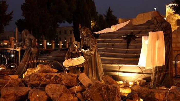 An installation depicting the nativity of Christ with a figure 
