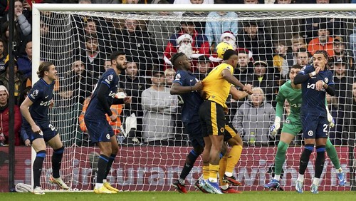 Wolverhampton Wanderers Mario Lemina, 3rd from right, scores his sides first goal during the English Premier League soccer match between Wolverhampton Wanderers and Chelsea at Molineux stadium in Wolverhampton, England, Sunday, Dec. 24, 2023. (Jacob King/PA via AP)