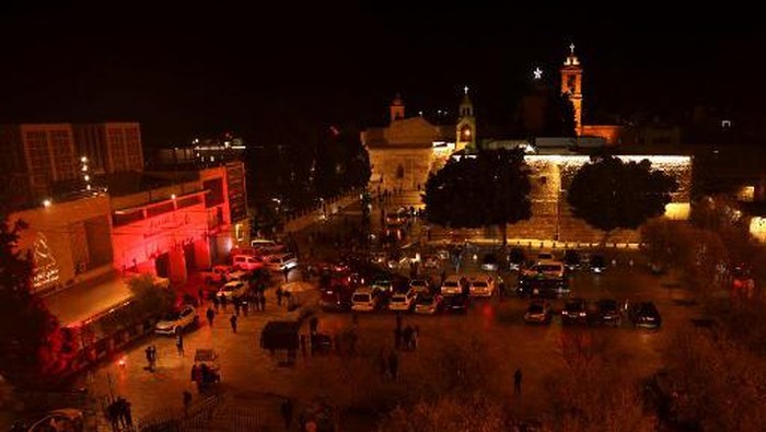 A view the Church of the Nativity in the biblical city of Bethlehem in the occupied West Bank on December 24, 2023, ahead of midnight mass. (Photo by HAZEM BADER / AFP)