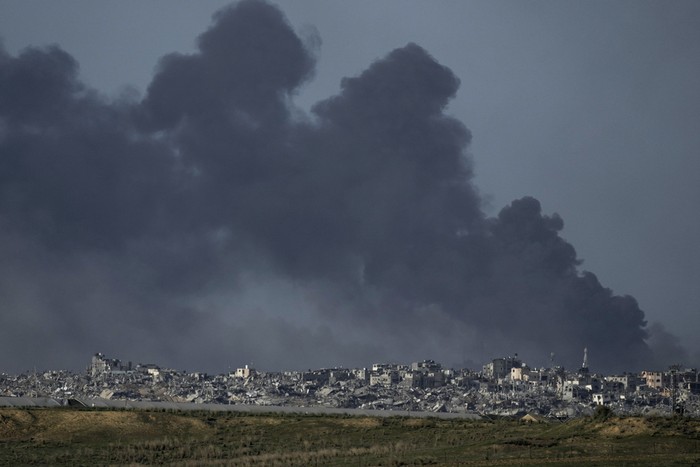 Smoke rises following an Israeli bombardment in the Gaza Strip, as seen from southern Israel, Tuesday, Dec. 26, 2023. The army is battling Palestinian militants across Gaza in the war ignited by Hamas Oct. 7 attack into Israel. (AP Photo/Leo Correa)