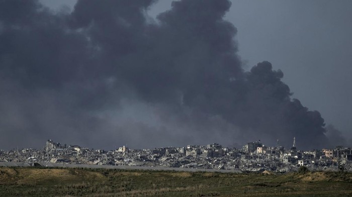 Smoke rises following an Israeli bombardment in the Gaza Strip, as seen from southern Israel, Tuesday, Dec. 26, 2023. The army is battling Palestinian militants across Gaza in the war ignited by Hamas' Oct. 7 attack into Israel. (AP Photo/Leo Correa)