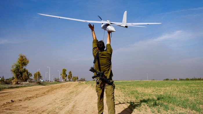 Israeli military tactical drone operators prepare a drone near the Gaza border, amid the ongoing conflict between Israel and the Palestinian Islamist group Hamas, in southern Israel, December 20, 2023. REUTERS/Clodagh Kilcoyne
