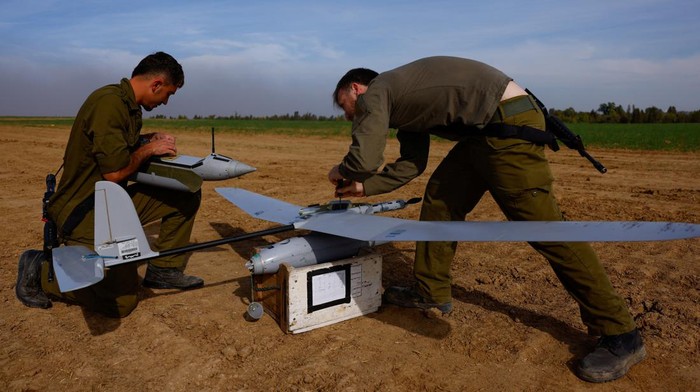 Israeli military tactical drone operators prepare a drone near the Gaza border, amid the ongoing conflict between Israel and the Palestinian Islamist group Hamas, in southern Israel, December 20, 2023. REUTERS/Clodagh Kilcoyne