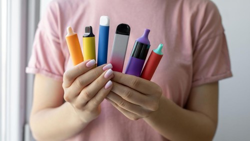 Vape cigarettes in woman hand