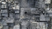 Bombardir serangan Israel meluluh lantakan Gaza. Bahkan sekitar separuh bangunan rusak. AP Photo/Hatem Moussa