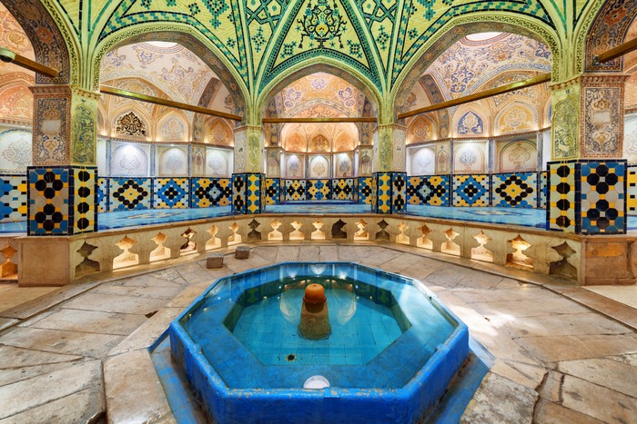 Pemandian Sultan Amir Ahmad Kashan, Iran - 21 October, 2018: Beautiful view of octagonal dressing hall (sarbineh) with pool in the middle at Sultan Amir Ahmad Bathhouse. Cloakroom of traditional Persian public bathhouse.