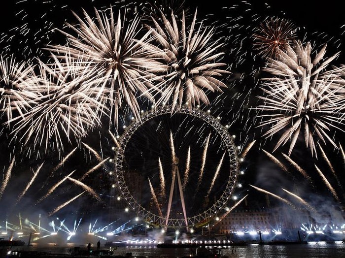 Fireworks light-up the sky over the London Eye in central London to celebrate the New Year on Monday, Jan. 1, 2024.(AP Photo/Alberto Pezzali)