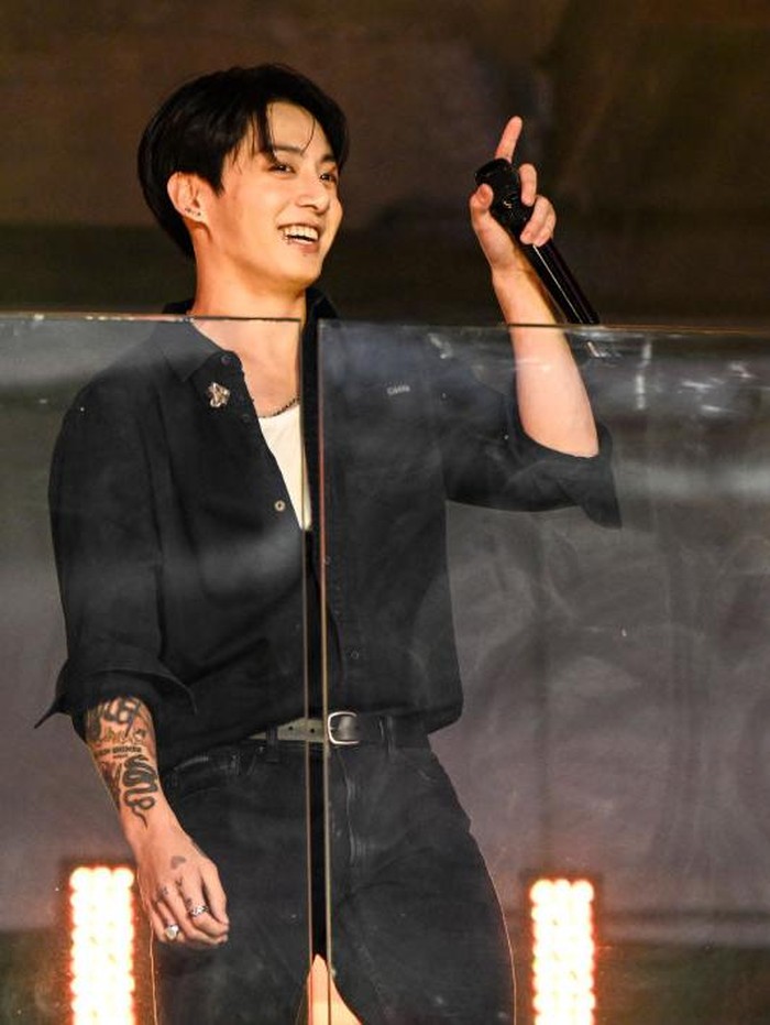 1773445965 Jung Kook performs during a surprise concert in Times Square on November 9, 2023 in New York City. (Photo by Daniel Zuchnik/Billboard via Getty Images)