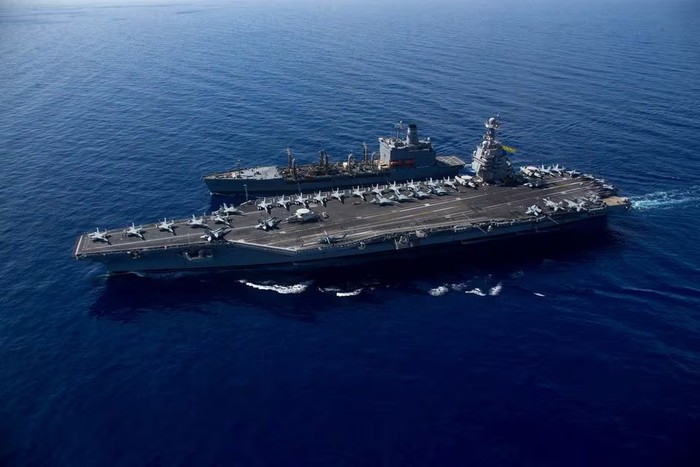 The worlds largest aircraft carrier USS Gerald R. Ford steams alongside USNS Laramie (T-AO-203) during a fueling-at-sea in the eastern Mediterranean Sea, as a scheduled deployment in the U.S Naval Forces Europe area of operations, deployed by U.S. Sixth Fleet to defend U.S, allied, and partners interests, in this photo taken on October, 11, 2023 and released by U.S. Navy on October 14, 2023. U.S Naval Forces Central Command / U.S. 6th Fleet / Handout via REUTERS/File Photo Acquire Licensing Rights