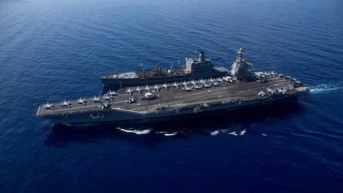 The worlds largest aircraft carrier USS Gerald R. Ford steams alongside USNS Laramie (T-AO-203) during a fueling-at-sea in the eastern Mediterranean Sea, as a scheduled deployment in the U.S Naval Forces Europe area of operations, deployed by U.S. Sixth Fleet to defend U.S, allied, and partners interests, in this photo taken on October, 11, 2023 and released by U.S. Navy on October 14, 2023. U.S Naval Forces Central Command / U.S. 6th Fleet / Handout via REUTERS/File Photo Acquire Licensing Rights