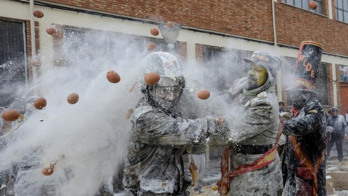 Revellers battle with flour and eggs during the traditional 