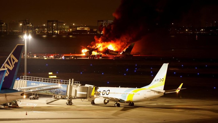 Japan Airlines A350 airplane is on fire at Haneda international airport in Tokyo, Japan January 2, 2024. REUTERS/Issei Kato
