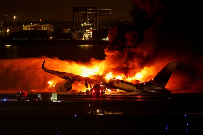 Japan Airlines A350 airplane is on fire at Haneda international airport in Tokyo, Japan January 2, 2024. REUTERS/Issei Kato