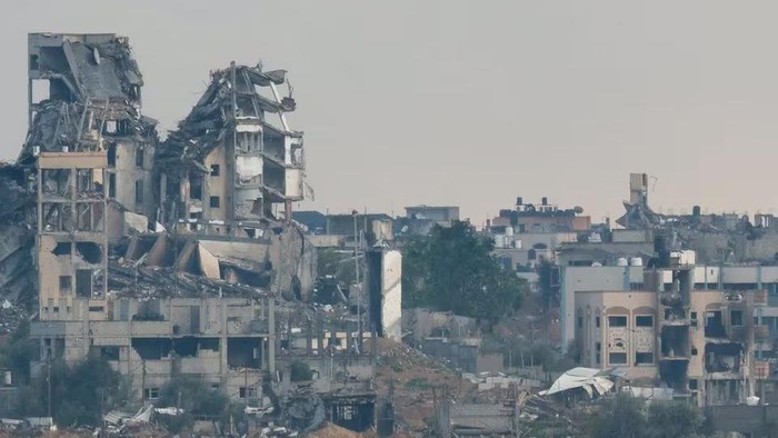 Destroyed buildings lie in ruin in the Gaza Strip, amid the ongoing conflict between Israel and the Palestinian Islamist group Hamas, as seen from Israel, January 2, 2024. REUTERS/Amir Cohen Acquire Licensing Rights