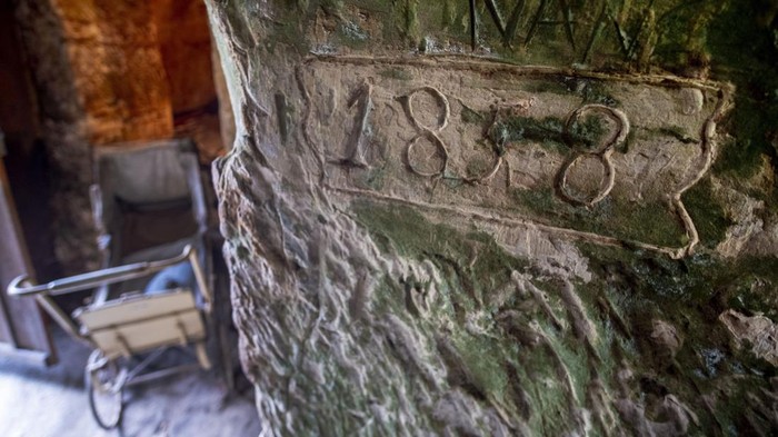 Germany Daily Life The inside of a cave dwelling is pictured in Langenstein, eastern Germany, Tuesday, Jan. 2, 2024. Workers of a nearby sheep farm built twelve of these caves in the rocks where they lived with their families from 1858 to 1910. (AP Photo/Michael Probst)