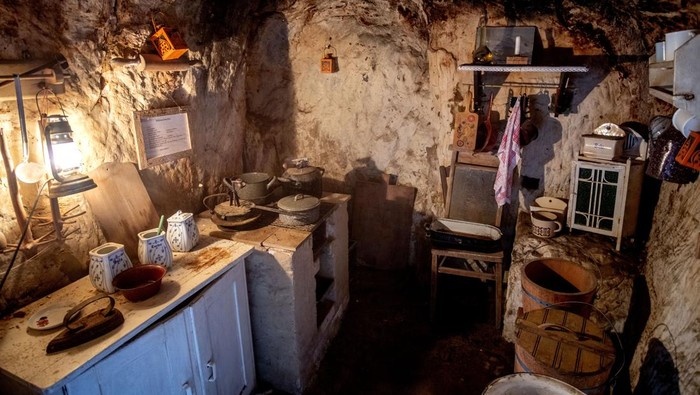 The inside of a cave dwelling is pictured in Langenstein, eastern Germany, Tuesday, Jan. 2, 2024. Workers of a nearby sheep farm built twelve of these caves in the rocks where they lived with their families from 1858 to 1910. (AP Photo/Michael Probst)
