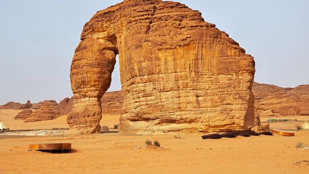 Buses are parked at different places in the desert to take tourists to different places during the day in Al-Ula, Saudi Arabia.