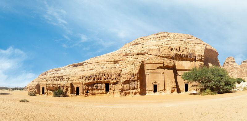 Buses are parked at different places in the desert to take tourists to different places during the day in Al-Ula, Saudi Arabia.