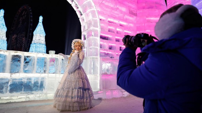 People visit an ice sculpture at the Harbin International Ice and Snow Festival, in Harbin, Heilongjiang province, China January 4, 2024. REUTERS/Tingshu Wang