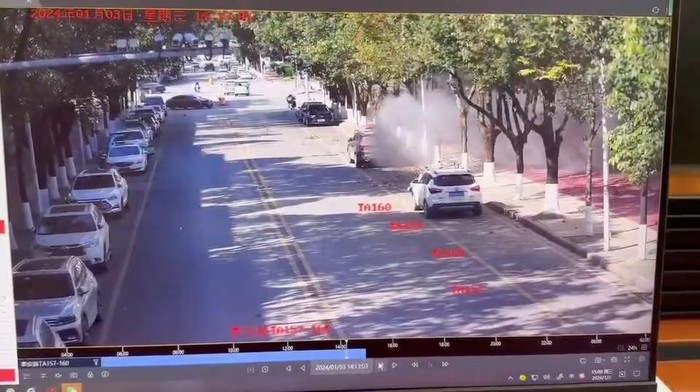 Smoke spreads on a road following an explosion after artillery shells fell in Nansan, Yunnan Province, China, in this screengrab obtained from a video of surveillance footage, released on January 3, 2024. Video Obtained By Reuters/via REUTERS Acquire Licensing Rights