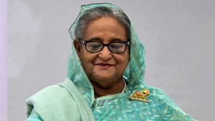 Bangladeshs Prime Minister Sheikh Hasina casts her vote at a polling station in Dhaka on January 7, 2024. Bangladesh began voting on January 7, in an election guaranteed to give a fifth term in office to Prime Minister Sheikh Hasina, after a boycott led by an opposition party she branded a 