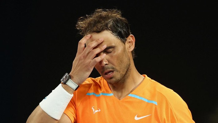 FILE PHOTO: Tennis - Australian Open - Melbourne Park, Melbourne, Australia - January 18, 2023 Spains Rafael Nadal looks dejected after losing his second round match against Mackenzie Mcdonald of the U.S. REUTERS/Carl Recine/File Photo