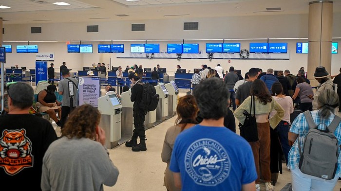 People rest, as passengers try to rebook their tickets from cancelled United Airlines flights after U.S. air safety regulator the Federal Aviation Administration (FAA) grounded 171 Boeing 737 MAX 9 jetliners for safety checks because of the emergency landing of an Alaska Airlines plane, at Luis Munoz Marin International Airport in San Juan, Puerto Rico January 7, 2024. (REUTERS/Miguel J. Rodriguez Carrillo)