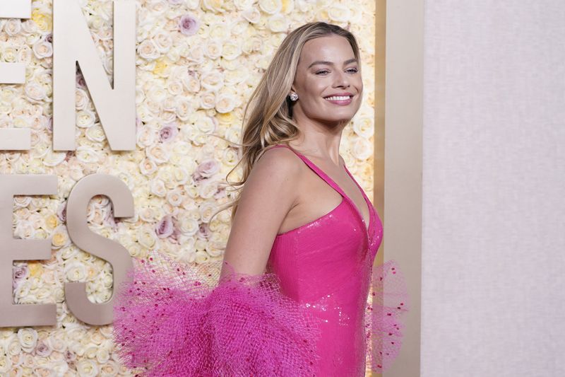 Margot Robbie arrives at the 81st Golden Globe Awards on Sunday, Jan. 7, 2024, at the Beverly Hilton in Beverly Hills, Calif. (Photo by Jordan Strauss/Invision/AP)