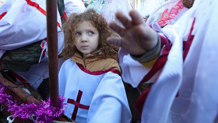A boy rides a donkey during the traditional religious procession Alilo celebrating Orthodox Christmas in Tbilisi, Georgia, January 7, 2024. REUTERS/Irakli Gedenidze     TPX IMAGES OF THE DAY