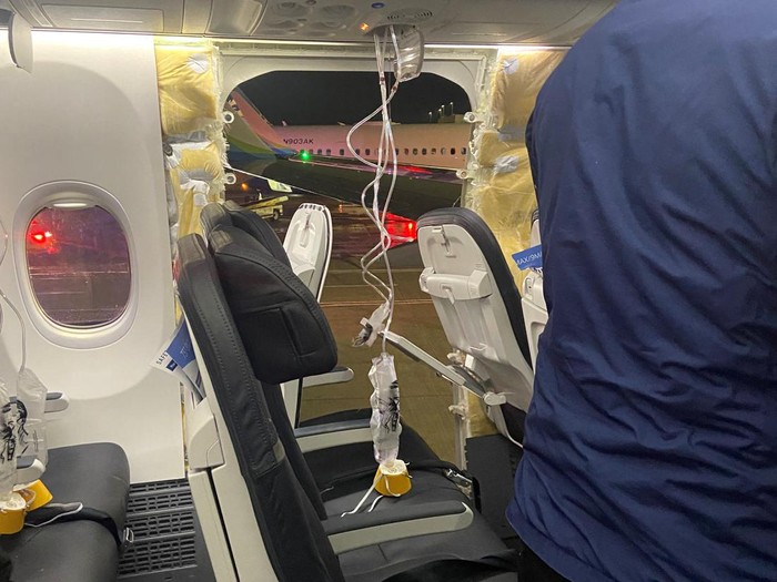 Passenger oxygen masks hang from the roof next to a missing window and a portion of a side wall of an Alaska Airlines Flight 1282, which had been bound for Ontario, California and suffered depressurization soon after departing, in Portland, Oregon, U.S., January 5, 2024 in this picture obtained from social media. Kyle Rinker via X/via REUTERS  THIS IMAGE HAS BEEN SUPPLIED BY A THIRD PARTY. MANDATORY CREDIT. NO RESALES. NO ARCHIVES.