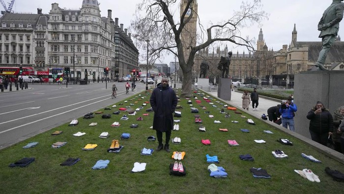 British Actor Idris Elba stands in Parliament Square with clothing representing the human cost of UK Knife Crime in London, Monday, Jan. 8, 2024, as he calls on the government to take immediate action to prevent serious youth violence. (AP Photo/Frank Augstein)