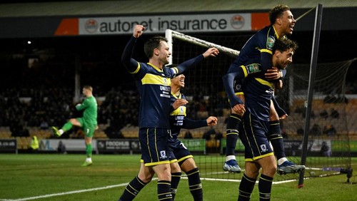Middlesbroughs English midfielder #25 Matt Crooks (L) celebrates with teammates after scoring his team third goal during the English League Cup quarter-final football match between Port Vale and Middlesbrough at Vale Park in Stoke-on-Trent, central England on December 19, 2023. (Photo by Oli SCARFF / AFP) / RESTRICTED TO EDITORIAL USE. No use with unauthorized audio, video, data, fixture lists, club/league logos or live services. Online in-match use limited to 120 images. An additional 40 images may be used in extra time. No video emulation. Social media in-match use limited to 120 images. An additional 40 images may be used in extra time. No use in betting publications, games or single club/league/player publications. /