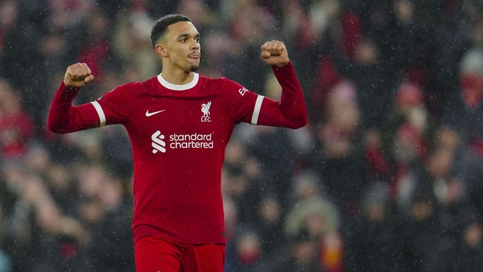 Liverpools Trent Alexander-Arnold celebrates at the end of the English Premier League soccer match between Liverpool and Newcastle, at Anfield stadium in Liverpool, England, Monday, Jan. 1, 2024. (AP Photo/Jon Super)