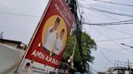 Spanduk AMIN Adu Gagasan Bukan Adu Pecitraan Muncul di Jalan Kepu Jakpus