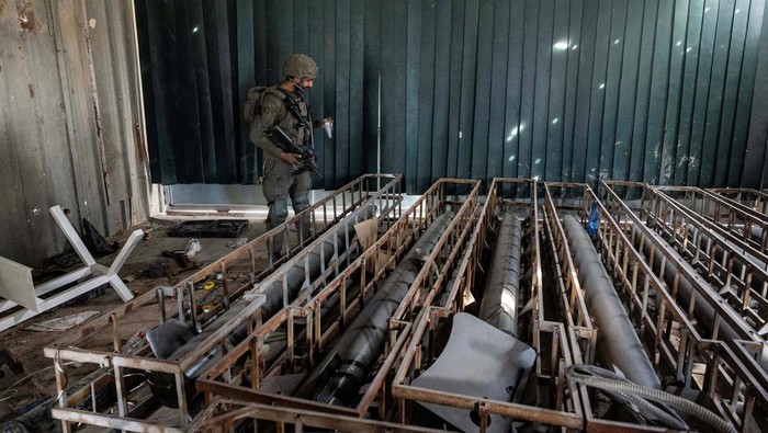 An Israeli soldiers inspects what the Israeli army said is a steel factory where rockets and other ammunition were produced, as he operates, amid the ongoing conflict between Israel and the Palestinian Islamist group Hamas, in Gaza, January 8, 2024. REUTERS/Ronen Zvulun EDITOR'S NOTE: REUTERS PHOTOGRAPHS WERE REVIEWED BY THE IDF AS PART OF THE CONDITIONS OF THE EMBED. TWO PHOTOS WERE REMOVED BY REUTERS UPON IDF REQUEST, CITING SECURITY CONCERNS. ONE SHOWED A TANK MARKING AND THE OTHER EXPOSED A LOCATION OF TROOPS     TPX IMAGES OF THE DAY