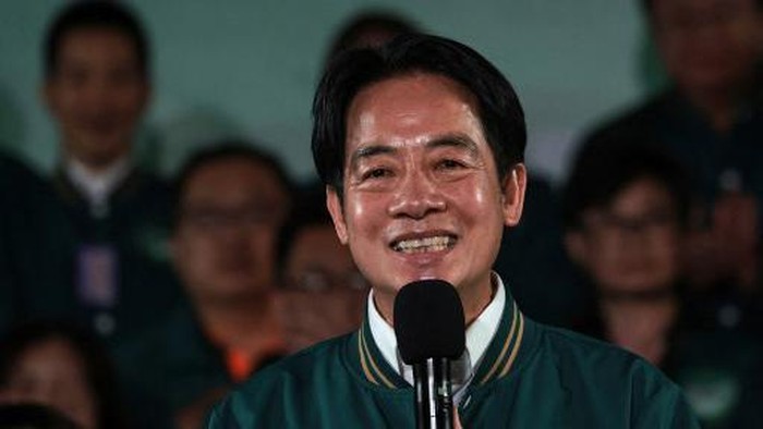 Taiwans President-elect Lai Ching-te smiles as he attends a rally outside the headquarters of the Democratic Progressive Party (DPP) in Taipei on January 13, 2024, after winning the presidential election. Taiwans ruling party candidate Lai Ching-te, branded a threat to peace by China, on January 13 won the islands presidential election, a vote watched closely from Beijing to Washington. (Photo by Yasuyoshi CHIBA / AFP)