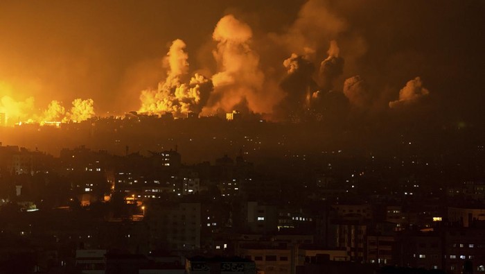 Fire and smoke rise following an Israeli airstrike, in Gaza City, Sunday, Oct. 8, 2023. The militant Hamas rulers of the Gaza Strip carried out an unprecedented, multi-front attack on Israel at daybreak Saturday, firing thousands of rockets as dozens of Hamas fighters infiltrated the heavily fortified border in several locations, killing hundreds and taking captives. (AP Photo/Fatima Shbair)