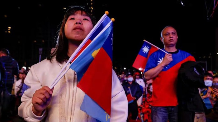 A woman looks on after the preliminary results of the presidential and parliamentary elections, in New Taipei City, Taiwan, January 13, 2024. REUTERS/Carlos Garcia Rawlins Acquire Licensing Rights
