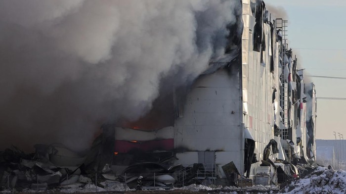 Smoke from fire rises above the burning warehouse of Wildberries online retailer in Saint Petersburg, Russia, January 13, 2024. REUTERS/Anton Vaganov