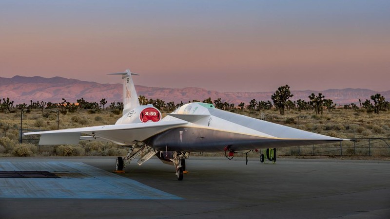 The experimental quiet supersonic aircraft X-59, a collaboration of Lockheed Martin's Skunk Works and NASA, is seen parked on tarmac in Palmdale, California, U.S. December 12, 2023.  Lockheed Martin/Garry Tice/Handout via REUTERS.   THIS IMAGE HAS BEEN SUPPLIED BY A THIRD PARTY
