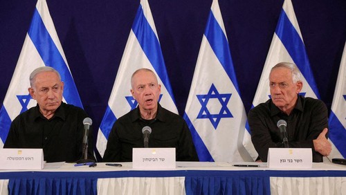 Israeli Prime Minister Benjamin Netanyahu, with Defense Minister Yoav Gallant and Cabinet minister Benny Gantz, holds a press conference in the Kirya military base in Tel Aviv, Israel, 28 October 2023. ABIR SULTAN POOL/Pool via REUTERS/File Photo Acquire Licensing Rights