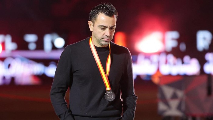 Barcelonas Spanish coach Xavi walks during the medal ceremony after the Spanish Super Cup final football match between Real Madrid and Barcelona at the Al-Awwal Park Stadium in Riyadh, on January 14, 2024. (Photo by Giuseppe CACACE / AFP)