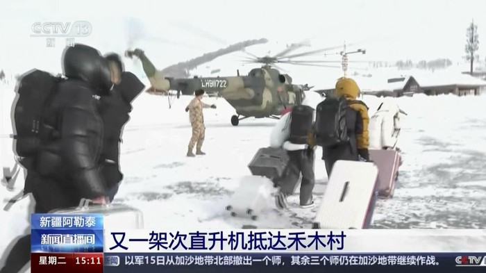 In this image taken from video footage run by Chinas CCTV, excavators clear a road blocked by snow in Altay Prefecture in northwestern Chinas Xinjiang Uyghur Autonomous Region on Tuesday, Jan. 16, 2024. Chinese state media says that rescuers are evacuating tourists from a remote skiing area in the countrys northwest where dozens of avalanches triggered by heavy snow have trapped more than 1,000 people for a week. (CCTV via AP)