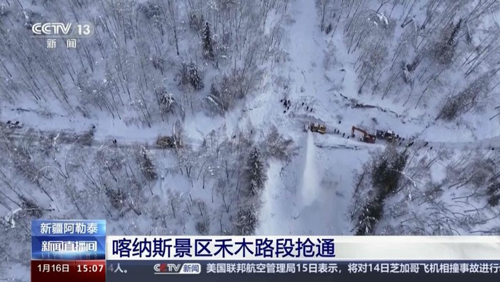 In this image taken from video footage run by Chinas CCTV, excavators clear a road blocked by snow in Altay Prefecture in northwestern Chinas Xinjiang Uyghur Autonomous Region on Tuesday, Jan. 16, 2024. Chinese state media says that rescuers are evacuating tourists from a remote skiing area in the countrys northwest where dozens of avalanches triggered by heavy snow have trapped more than 1,000 people for a week. (CCTV via AP)