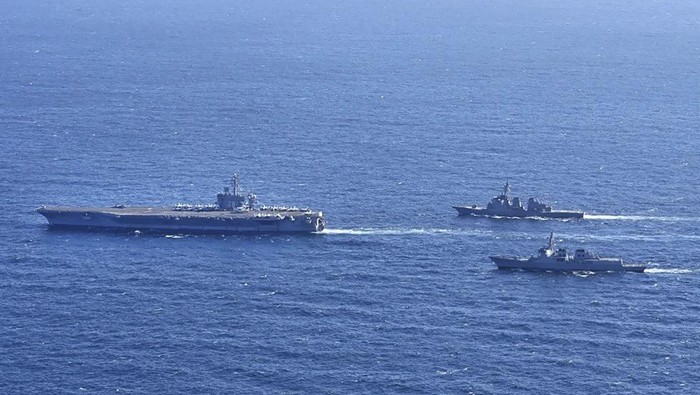 In this photo provided by South Korea’s Joint Chiefs of Staff, the aircraft carrier USS Carl Vinson, left, sails with South Korean Navy’s Aegis destroyer King Sejong the Great and Japan’s Maritime Self-Defense Force Aegis destroyer Kongou in the international waters of the southern coast of Korean peninsular during a recent joint drill in 2024. The three countries conducted combined naval exercises involving the American aircraft carrier in their latest show of strength against nuclear-armed North Korea, South Korea’s military said Wednesday, Jan. 17, as the three countries’ senior diplomats were to meet in Seoul to discuss the deepening standoff with Pyongyang. (South Korea’s Joint Chiefs of Staff via AP)