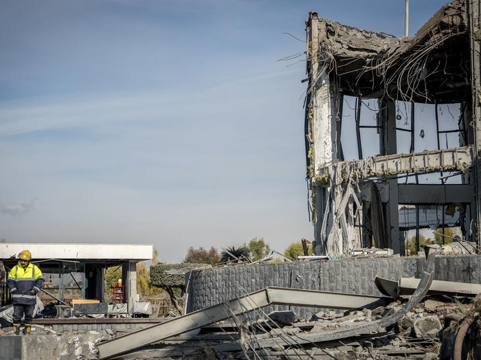 A man stands in front of the house of Peshraw Dizayi that was hit in Iranian missile strikes in Irbil, Iraq, Tuesday, Jan. 16, 2024. Dizayi, a prominent local businessman, was killed in one of the Irbil strikes along with members of his family. (AP Photo/Julia Zimmermann/Metrography)