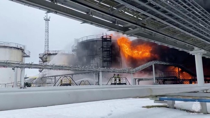 Firefighters extinguish oil tanks at a storage facility that local authorities say caught fire after the military brought down a Ukrainian drone, in the town of Klintsy in the Bryansk Region, Russia January 19, 2024, in this still image taken from video. Russian Emergencies Ministry/Handout via REUTERS ATTENTION EDITORS - THIS IMAGE HAS BEEN SUPPLIED BY A THIRD PARTY. NO RESALES. NO ARCHIVES. MANDATORY CREDIT.