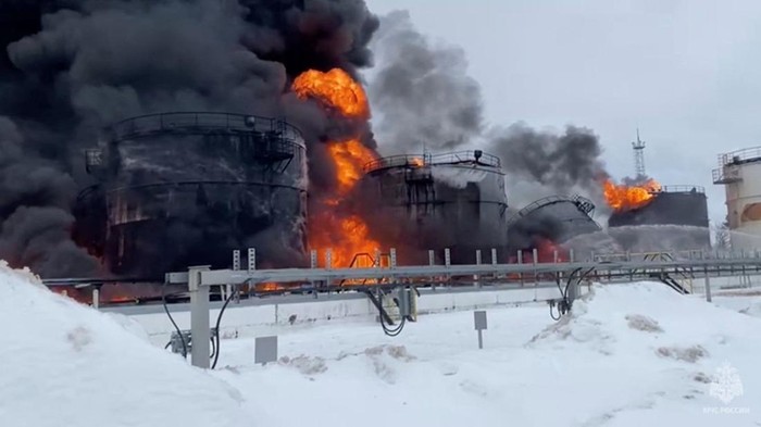 Firefighters extinguish oil tanks at a storage facility that local authorities say caught fire after the military brought down a Ukrainian drone, in the town of Klintsy in the Bryansk Region, Russia January 19, 2024, in this still image taken from video. Russian Emergencies Ministry/Handout via REUTERS ATTENTION EDITORS - THIS IMAGE HAS BEEN SUPPLIED BY A THIRD PARTY. NO RESALES. NO ARCHIVES. MANDATORY CREDIT.